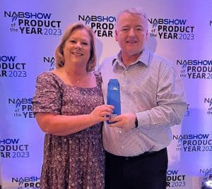 Dawn Shewmaker, Tieline VP US Operations, and Tieline CEO Will McLean accept the Product of the Year Award